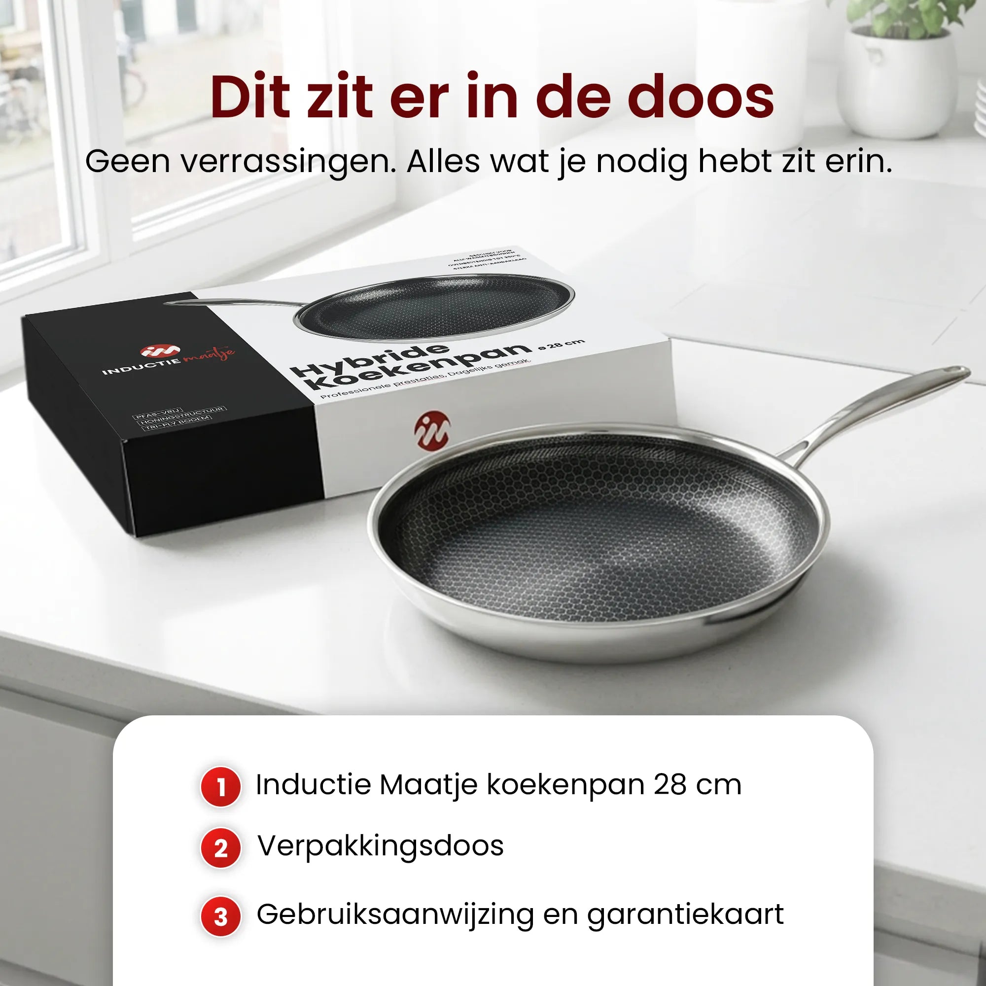 Inductie Maatje hybride koekenpan van 28 cm met verpakking, gebruiksaanwijzing en garantiekaart.